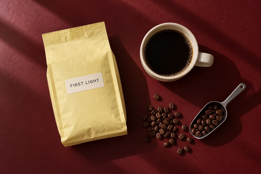 First Light coffee bag and a cup of coffee